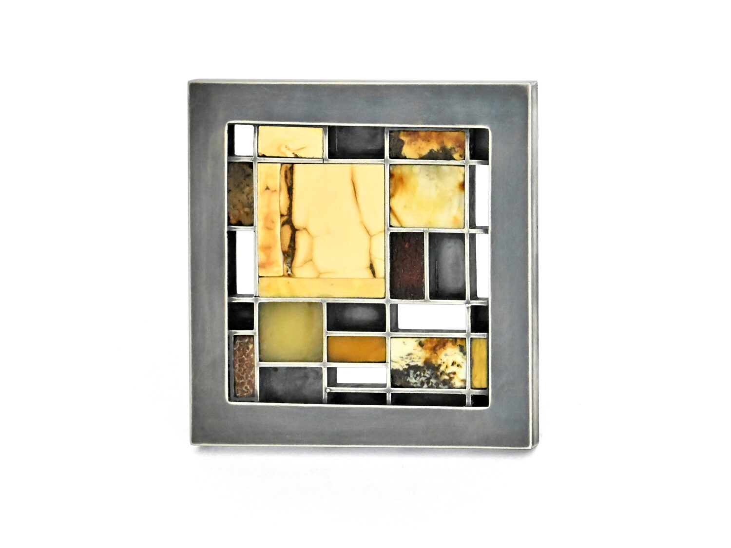 »Hommage a Mondrian«, Brooch, oxidised silver, amber, 2025